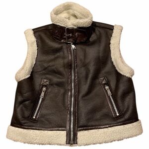 Brown leather vest with Sherpa lining silver zipper and buckle neck.